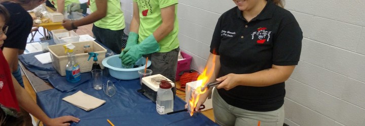 person in gym lighting money on fire for children